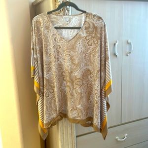 Poncho style top. Comfortable, airy, flowy.